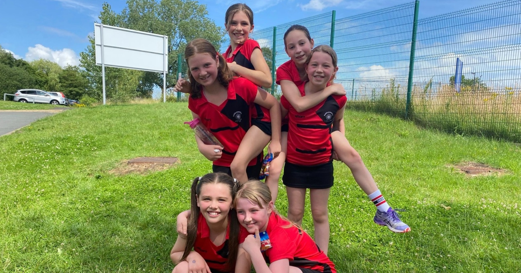 Players together on the grass after a tournament