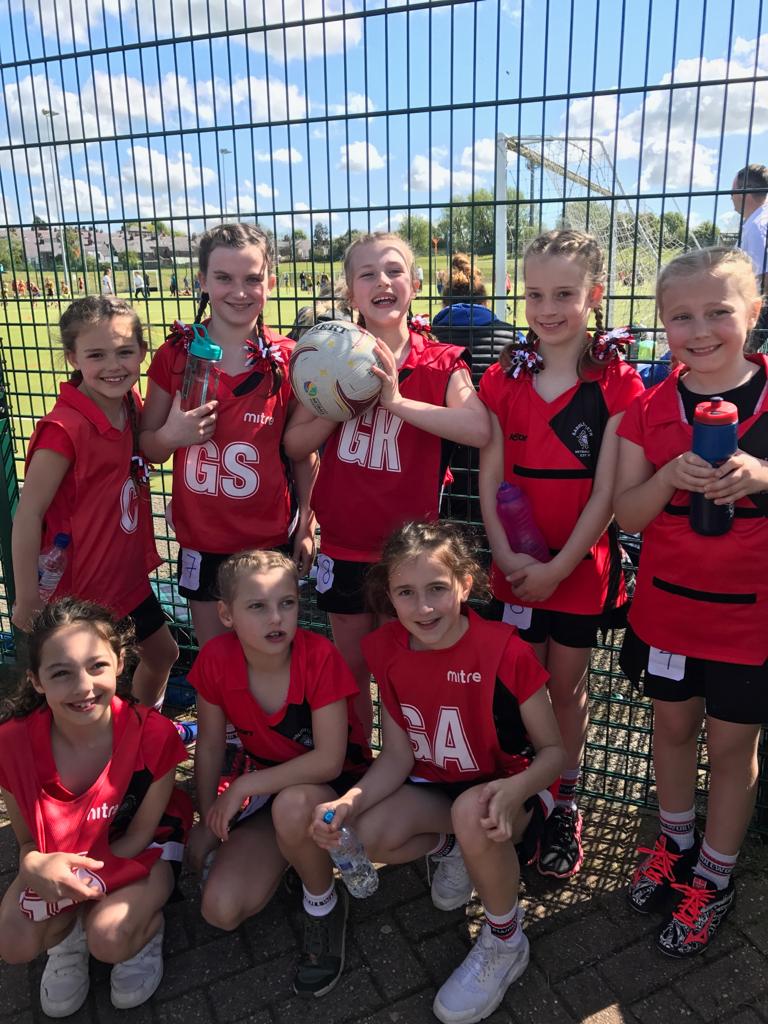 Players in red kit at a tournament